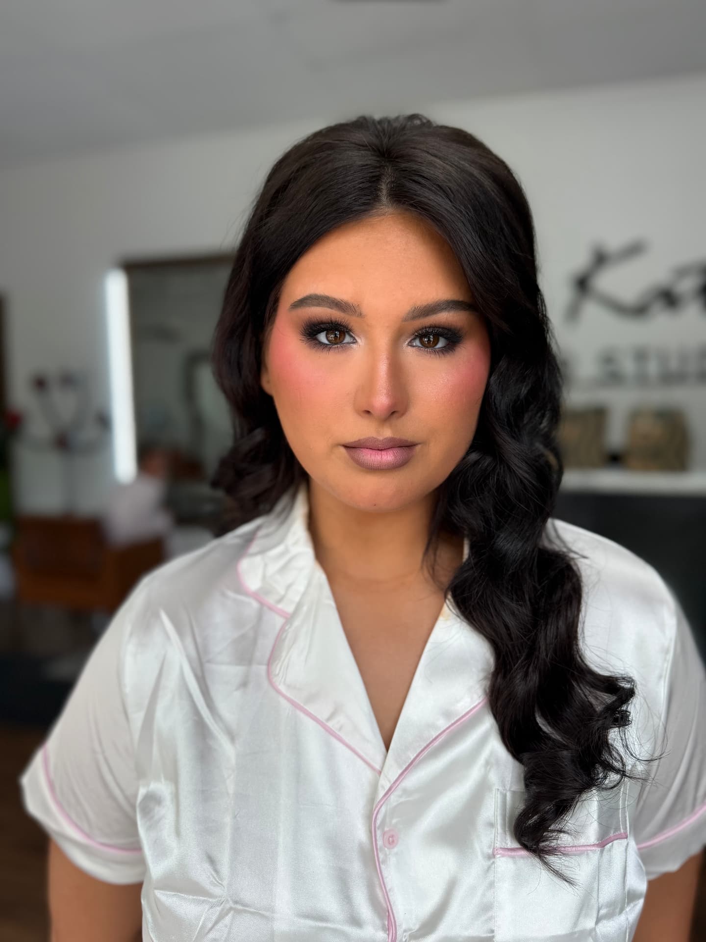 Soft glam makeup with warm blush and full lashes