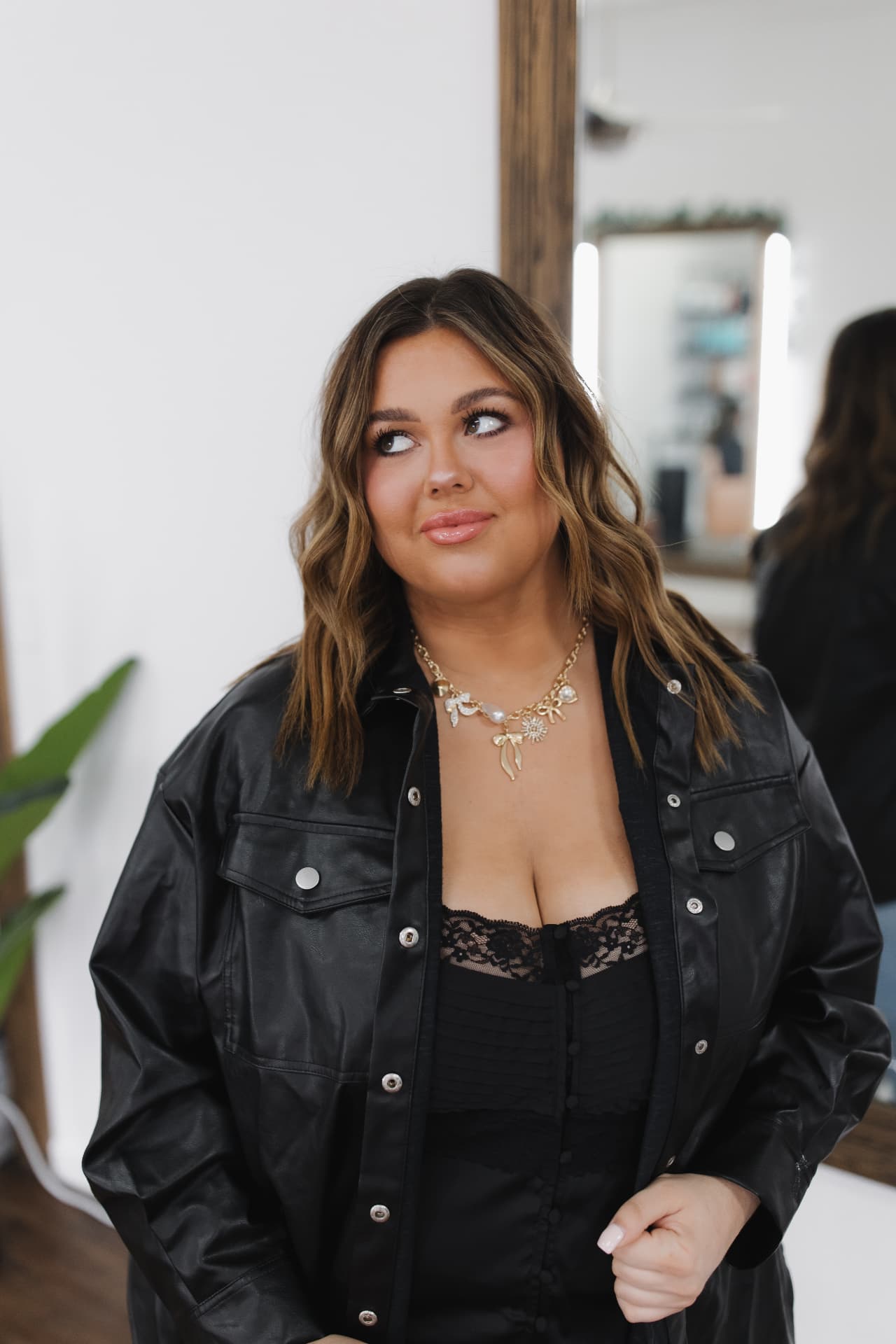 Emily glancing to the side inside her makeup studio